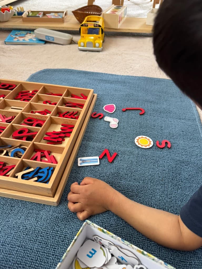 Matching initial sounds with moveable alphabet and pictures