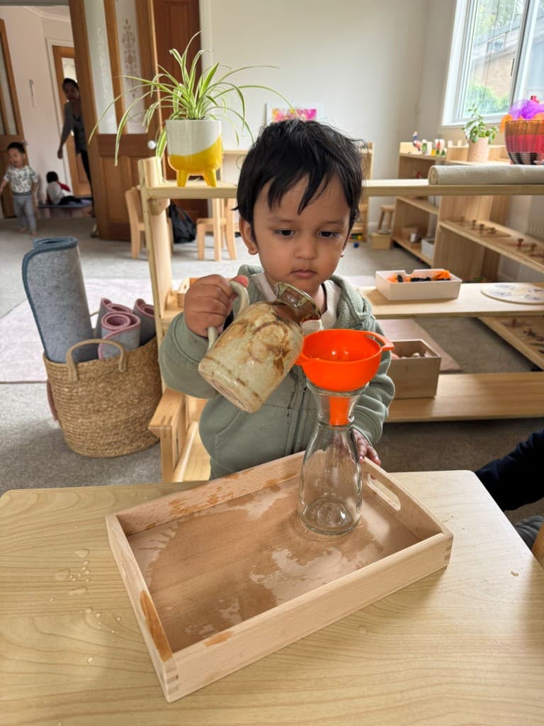 Practical life activity — water pouring with funnel